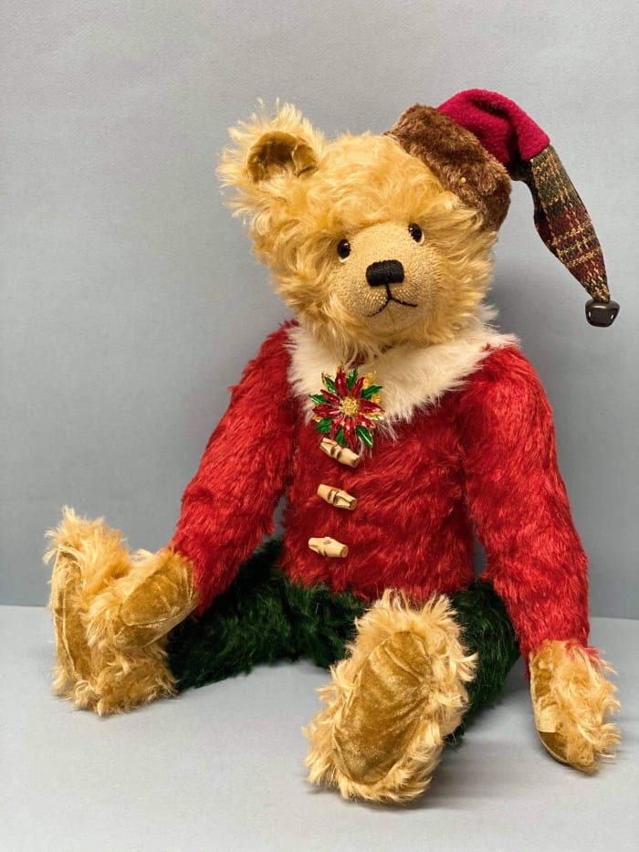 Jerry Abraham has more than 300 teddy bears in his collection, including this designer Kringle bear. He takes some of them with him when he travels around the world.