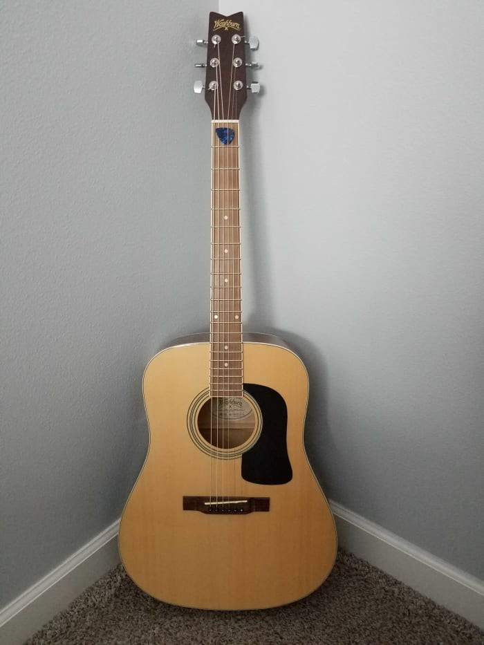 At the ready, my trusty -- and unplayed -- Washburn guitar bought at Dave's Guitar Shop in La Crosse, Wisconsin.