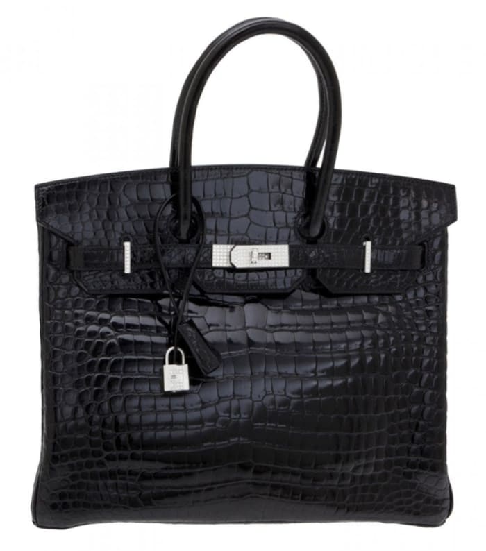 Hermès shiny black crocodile, diamond and white gold Birkin 35 handbag. Sold by Christie's through LiveAuctioneers for $287,500.